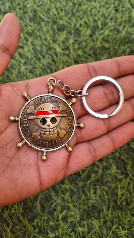 One-piece skull spinner keychain